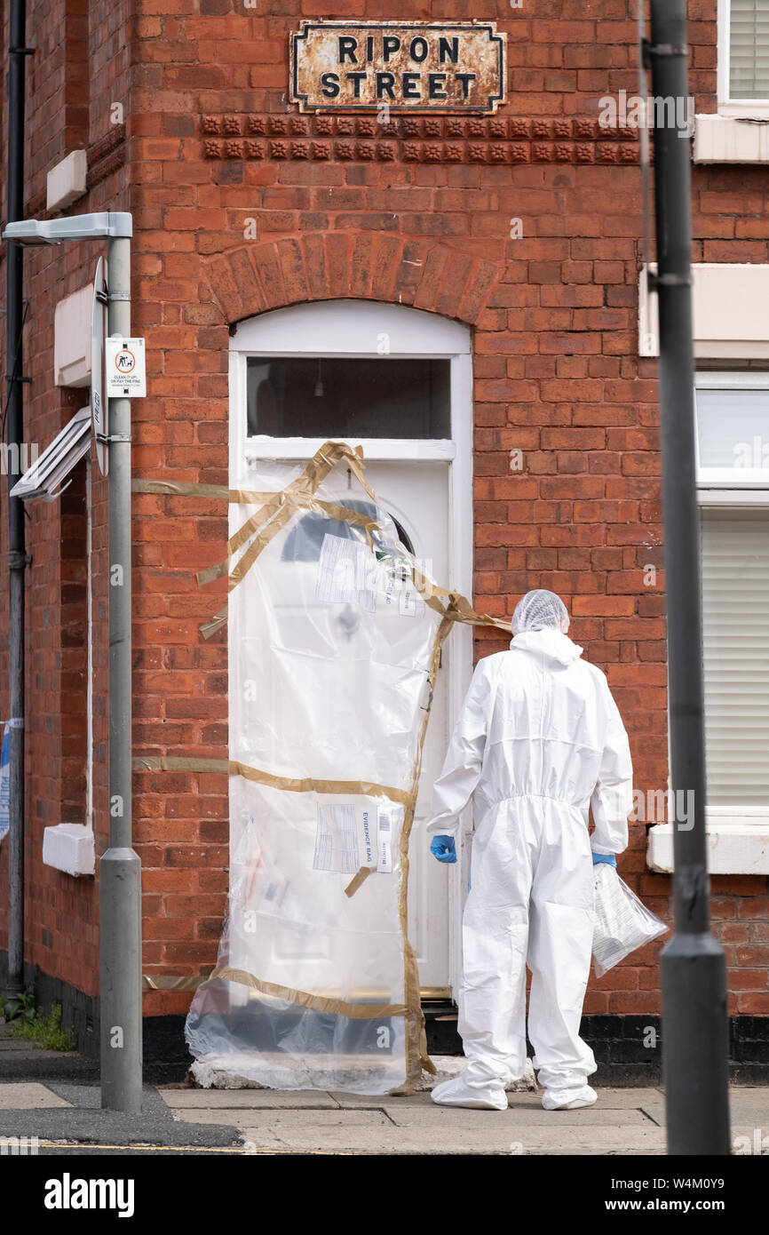 Liverpool, UK. 24th July, 2019. Police forensics working at the scene of a shooting after emergency services were called to Ripon Street near to Everton Football Club's, Goodison Park stadium at 10:30pm on Tuesday. Two men approached the victim outside his house wearing balaclavas. The gunman is then believed to have fired shots through the letterbox of the address injuring the man and his dog. The 36-year-old victim was treated by paramedics before being taken to hospital for gunshot wounds to his leg. The victim's dog died a short time later. Credit: Christopher Middleton/Alamy Live News Stock Photo