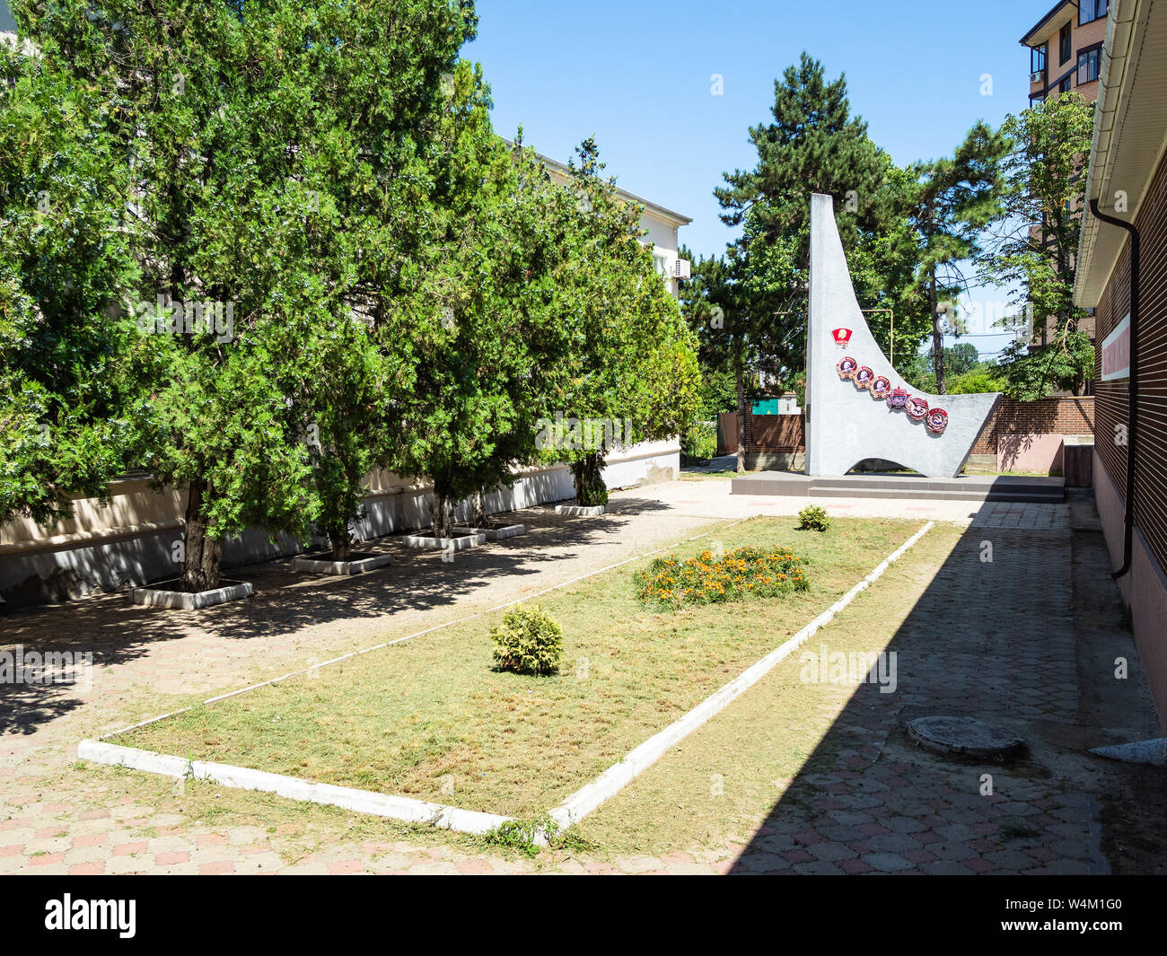 ABINSK, RUSSIA - JULY 2, 2019: Monument to Komsomol (All-Union Leninist Young Communist League) on Internatsionalnaya street in Abinsk city. Stock Photo