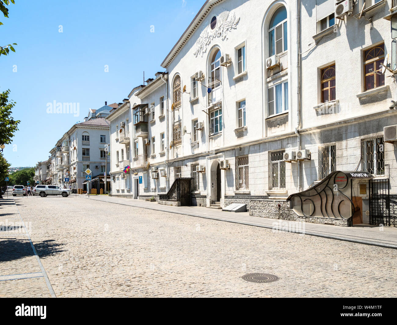 NOVOROSSIYSK, RUSSIA - JULY 7, 2019: old apartment houses on street of the Novorossiysk Republic. Novorossiysk is city in Krasnodar Krai, Russia, it i Stock Photo