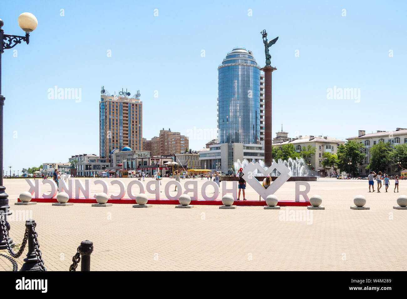 NOVOROSSIYSK, RUSSIA - JULY 7, 2019: tourists on Forum Square on Admiral Serebryakov Embankment in sea port of Novorossiysk city . Novorossiysk is mai Stock Photo