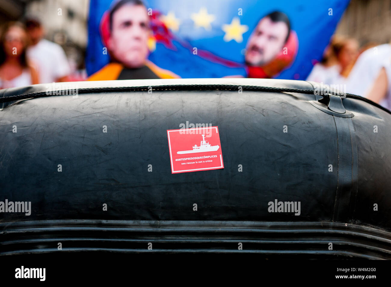proactiva open arms ngo sticker on rubber dinghy boat during public protest against italian far right politics and politicians against immigration in Stock Photo