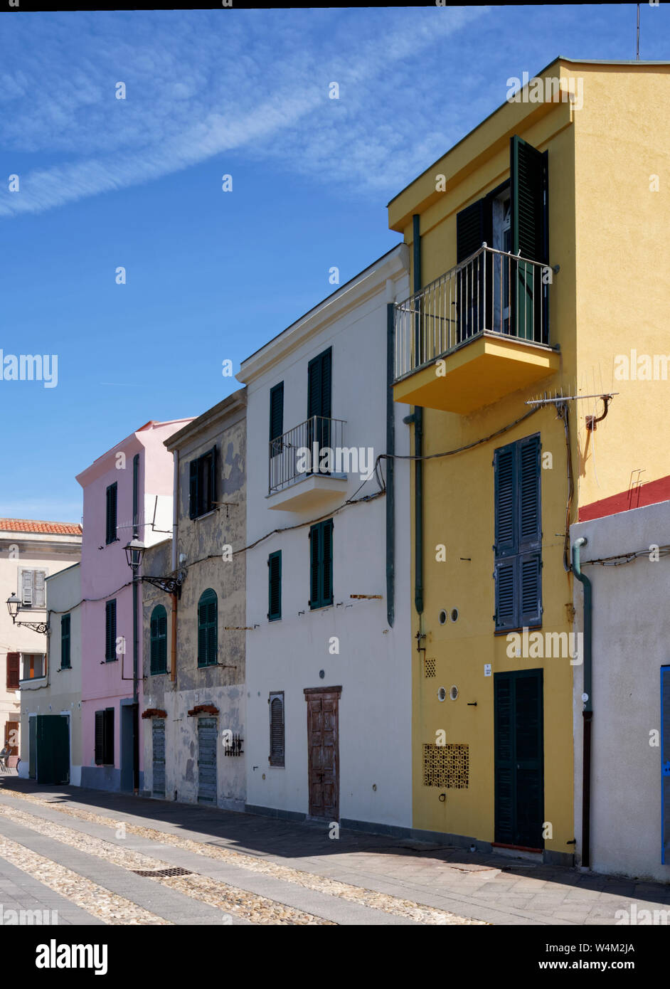 Row of colourful houses along the promenade in Alghero in Sardinia Stock Photo