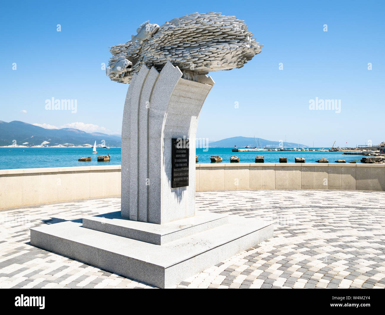NOVOROSSIYSK, RUSSIA - JULY 7, 2019: Monument to the Black Sea fish Khamsa (European anchovy) on Admiral Serebryakov Embankment of Tsemes Bay in Novor Stock Photo