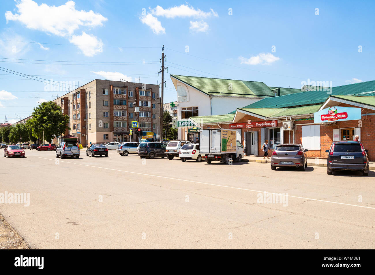 ABINSK, RUSSIA - JULY 9, 2019: car parking on square near city market on Komsomolskaya street in Abinsk city. Abinsk is town and administrative center Stock Photo