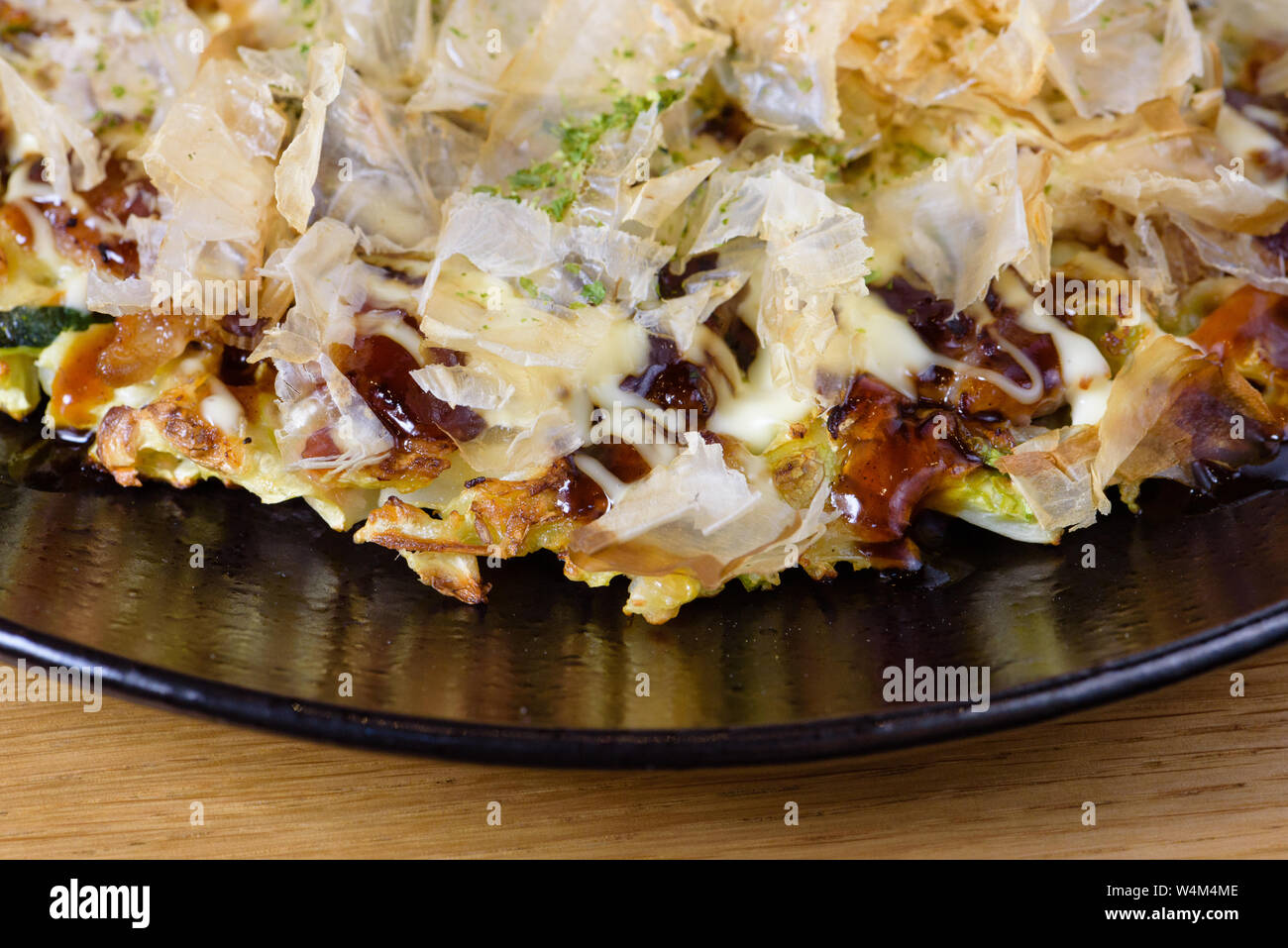 traditional Japanese omelette Okonomiyaki, with eggs, Savoy cabbage