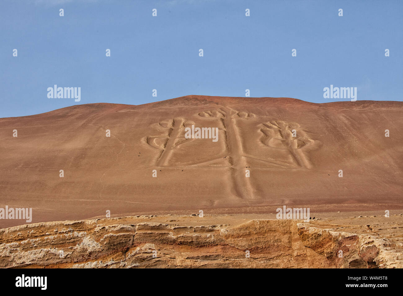 Famous figure Candelabrum in Paracas national park, Peru.  The Paracas Candelabra, also called the Candelabra of the Andes, is a well-known prehistori Stock Photo