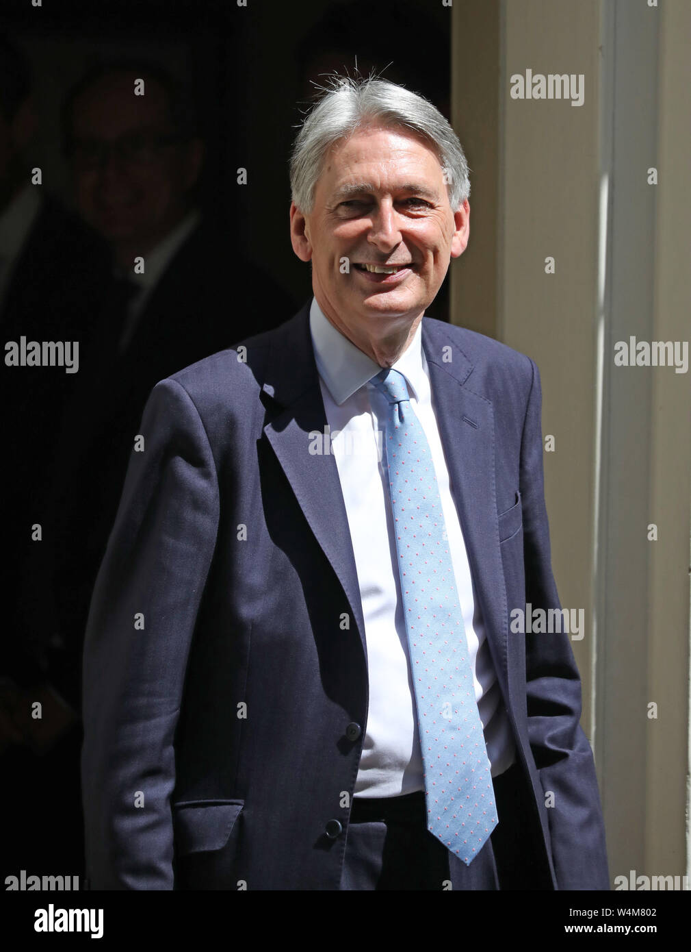 London, UK. 24th July, 2019. Philip Hammond, Chancellor of the Exchequer shakes hands with his staff as he leaves Number 11 Downing Street to go to Prime Ministers Questions in the House of Commons. She will then visit Queen Elizabeth II and step  down as Prime Minister, before Boris Johnson takes over as the new Prime Minister at Number 10 Downing Street, London, on July 24, 2019 Credit: Paul Marriott/Alamy Live News Stock Photo