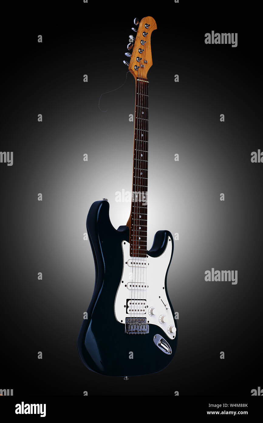 Beautiful guitar. Isolated on a black background with vignette Stock Photo