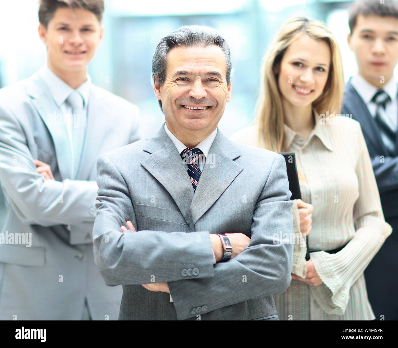 Group portrait of a professional business team looking confidently at ...