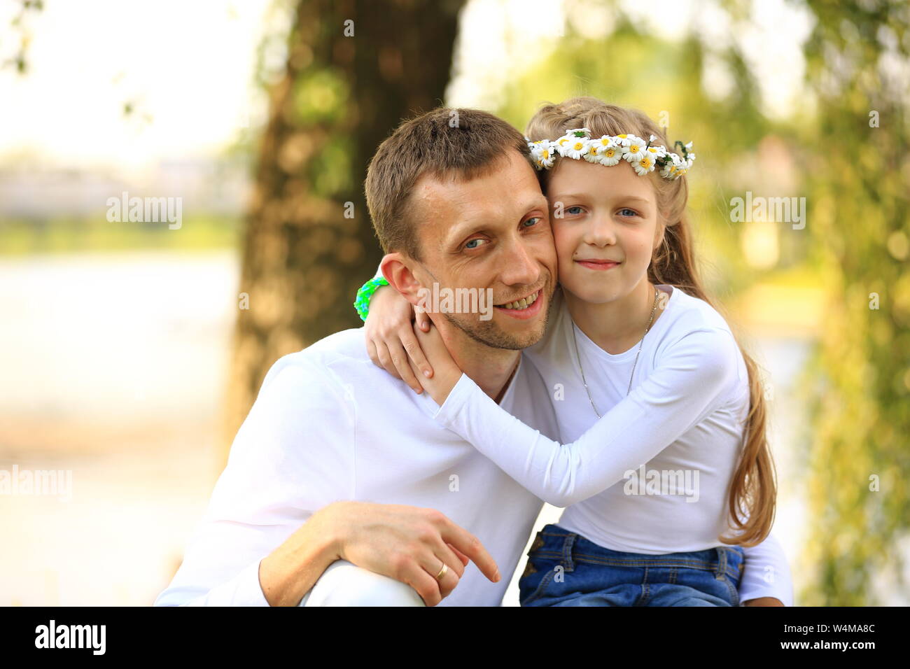 fatherhood - happy father and little daughter hugging each other in the ...
