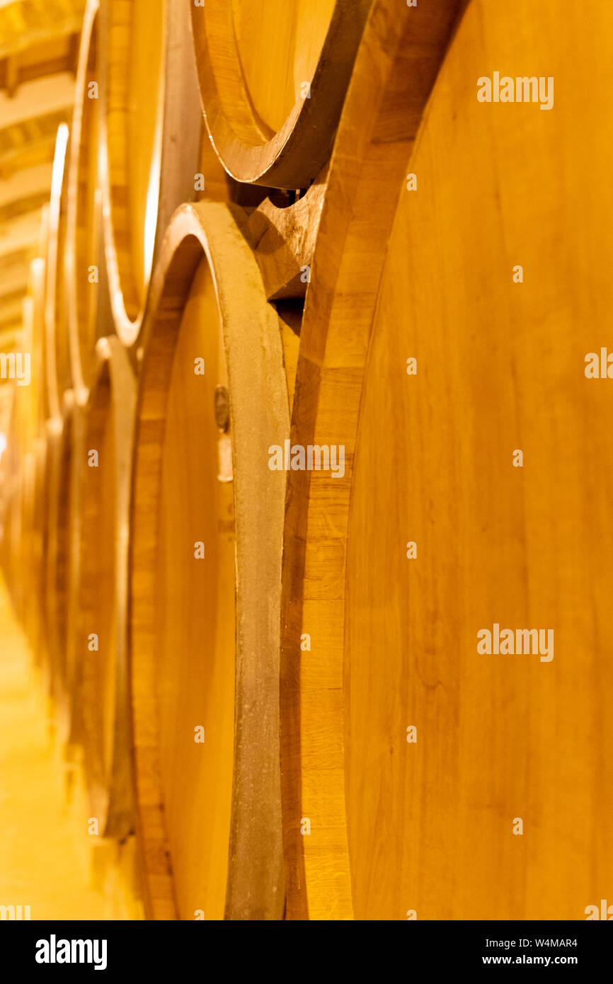 Vintage wine cellar with old oak barrels, production of fortified dry or sweet tasty marsala wine in Marsala, Sicily, Italy Stock Photo