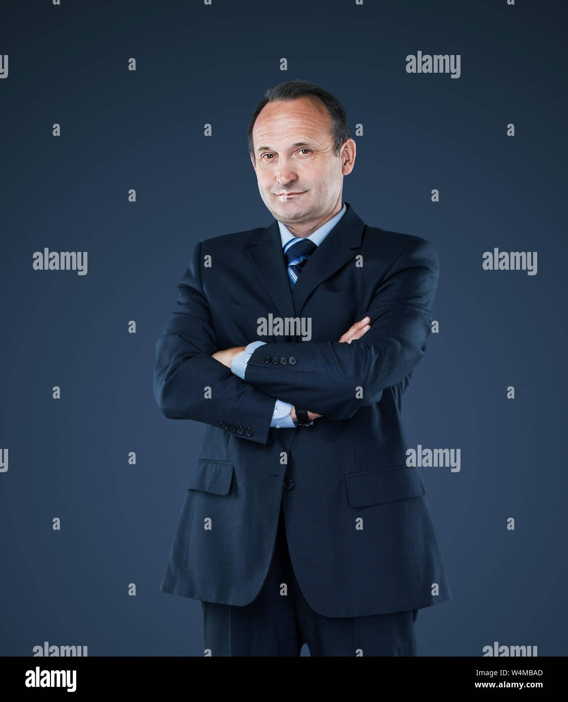 Confident successful business man isolated on dark background Stock ...