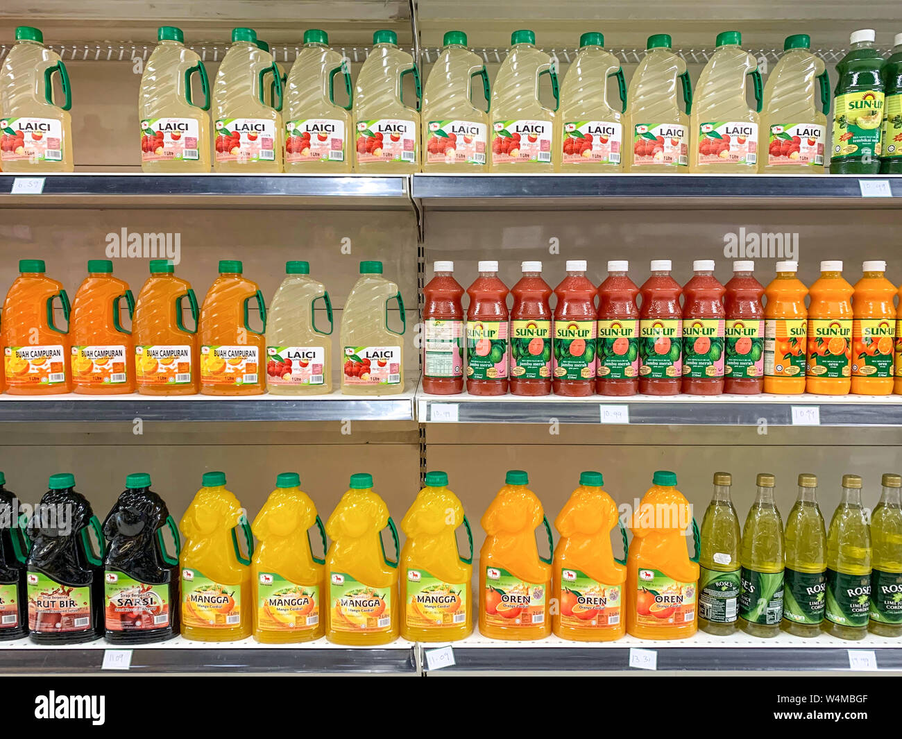 Kuala Lumpur, Malaysia - July 21, 2019: Various type of bottled drinks and juices on display at the shelves of Cold Storage supermarket. Illustrative Stock Photo