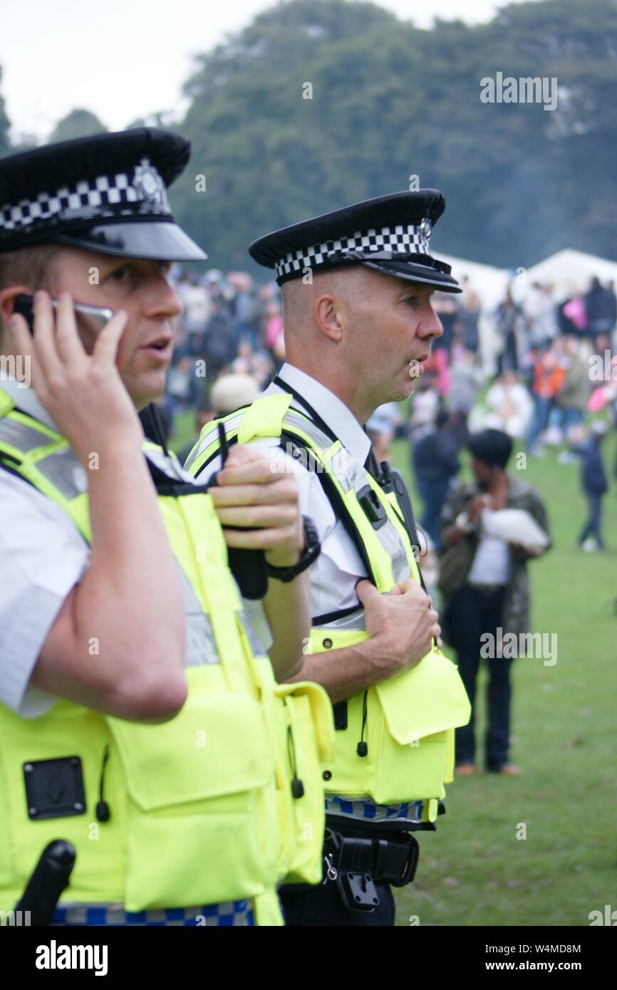 police officer taking on phone Stock Photo