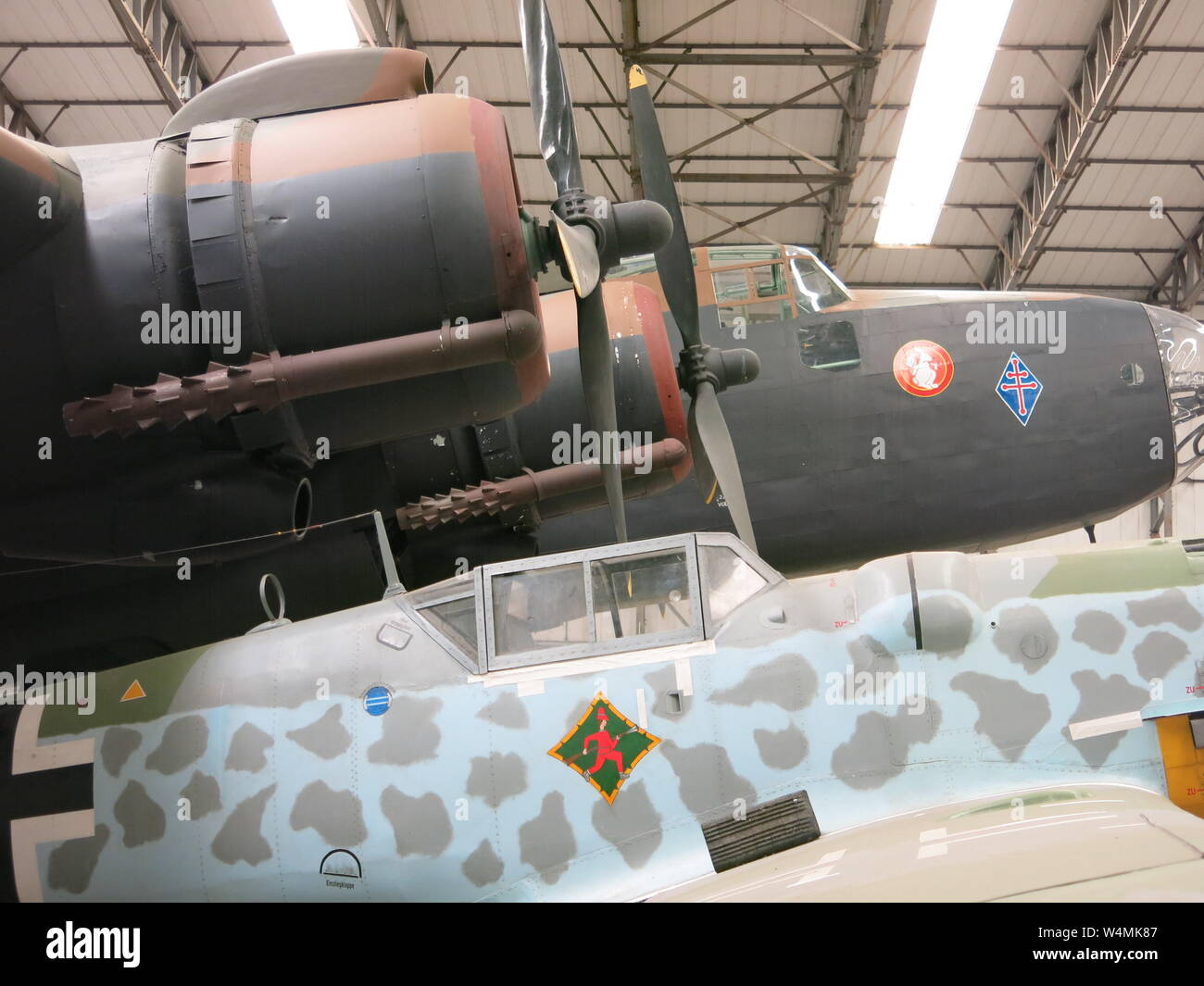 Closeup side view of the two engines, propellers and cockpit of the