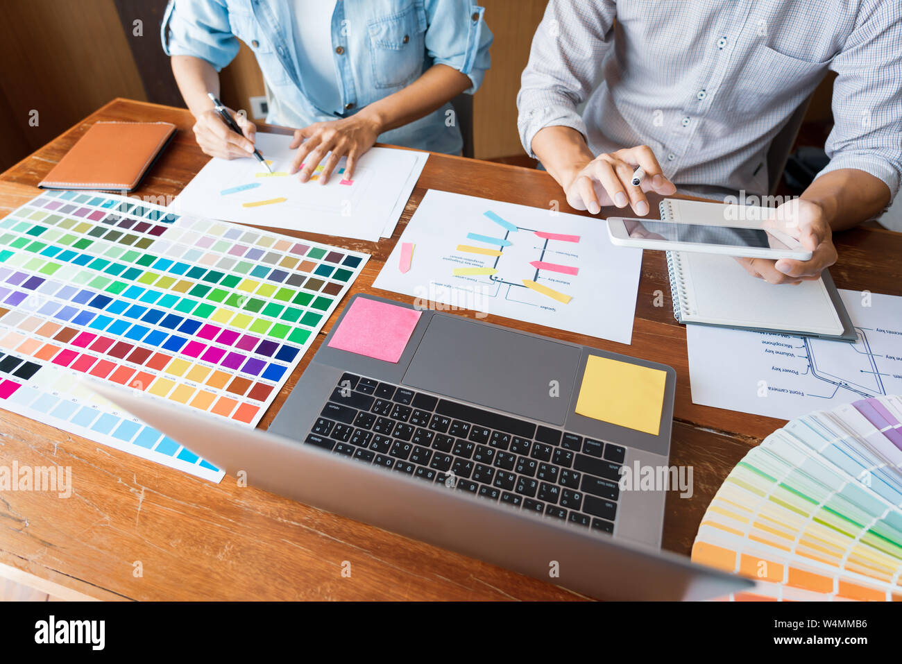 business technology concept, creative team designer choosing samples with UI/UX developing on sketch layout design mockup on smartphone application fo Stock Photo
