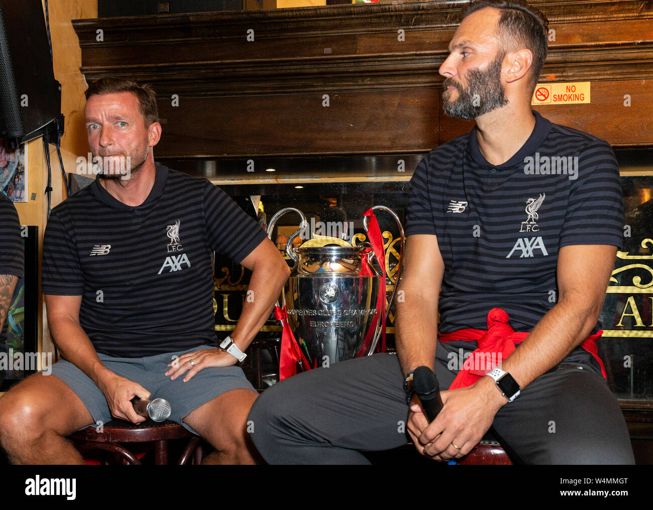 New York, NY - July 23, 2019: Vladi Smicer, Patrick Berger and UEFA Champions League Cup on display during Liverpool FC Fan Event at Carragher’s Bar Stock Photo