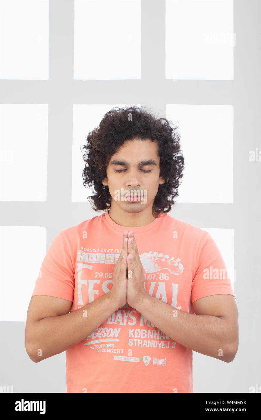 Young man praying thinking hi-res stock photography and images - Alamy