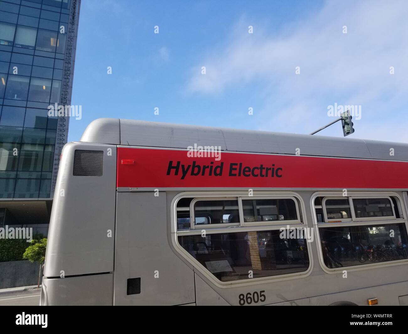 Side view of hybrid electric San Francisco Municipal Railroad (MUNI) public transit bus in the Mission Bay neighborhood of San Francisco, California, June 18, 2019. () Stock Photo