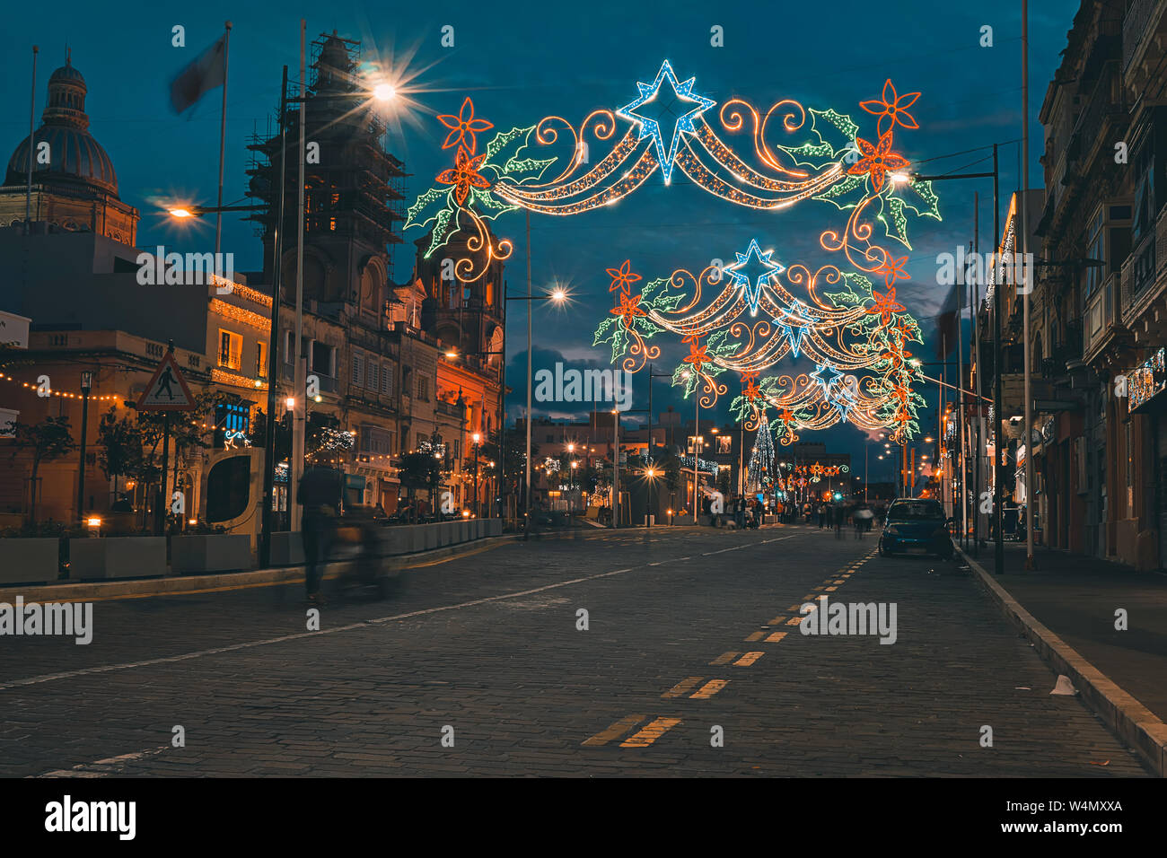 Festive Christmas illumination and decorations on streets of Paola