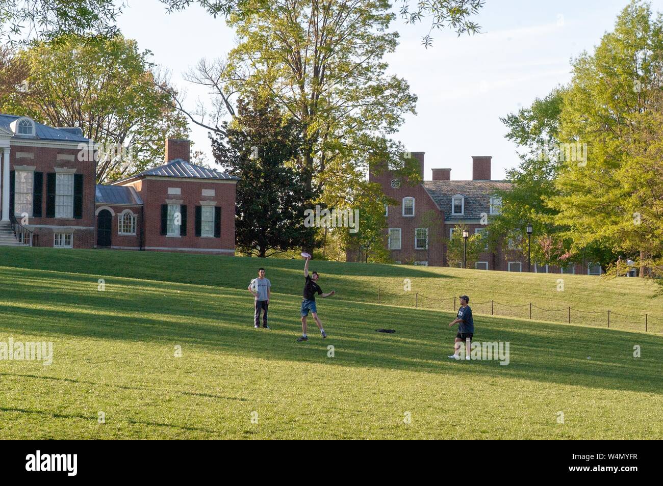 Students play Frisbee outdoors on the large lawn known as The Beach on the Homewood Campus at the Johns Hopkins University in Baltimore, Maryland, April 28, 2004. From the Homewood Photography collection. () Stock Photo