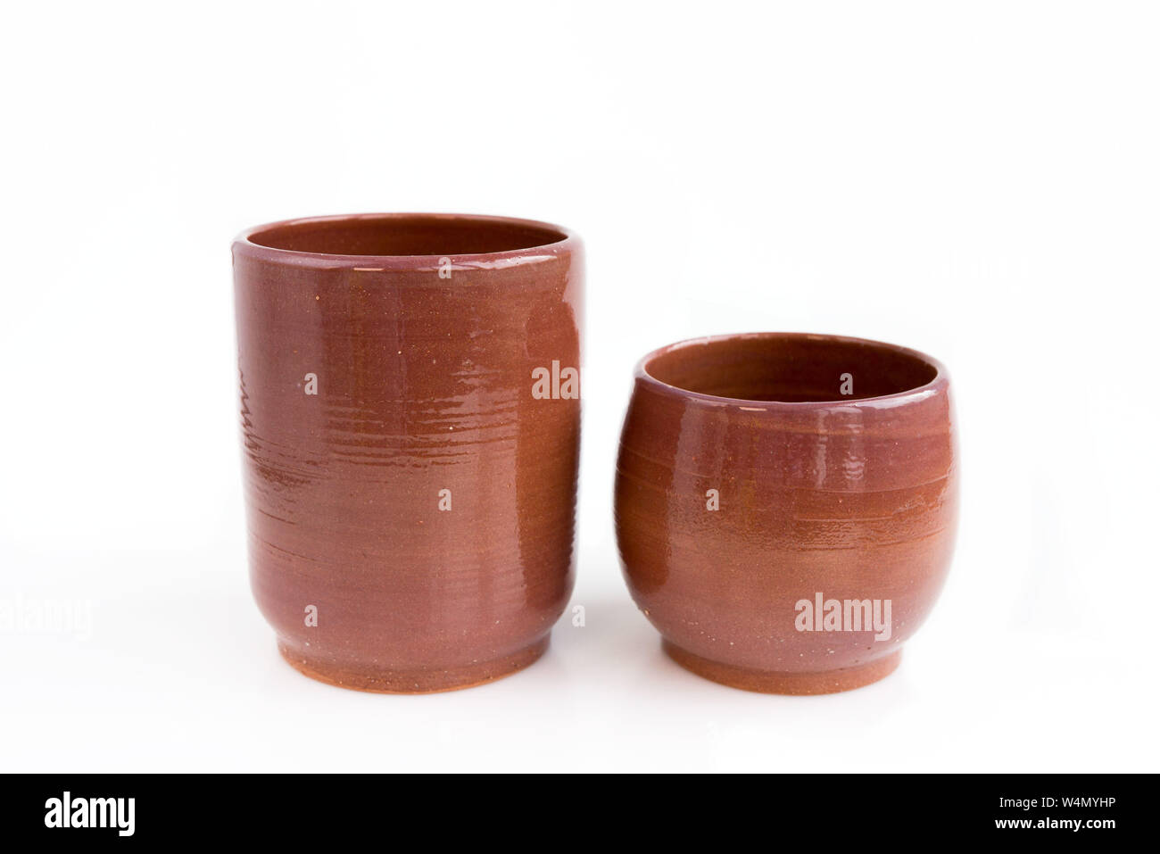 two decorative clay vases. Made by hand on a potter's wheel. In a single copy. On white