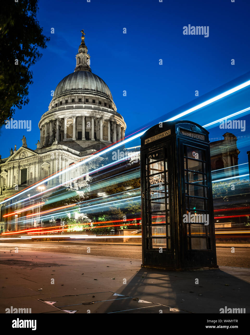 St Paul's Cathedral, Black Telephone Box, and Light Trails, London, UK Stock Photo