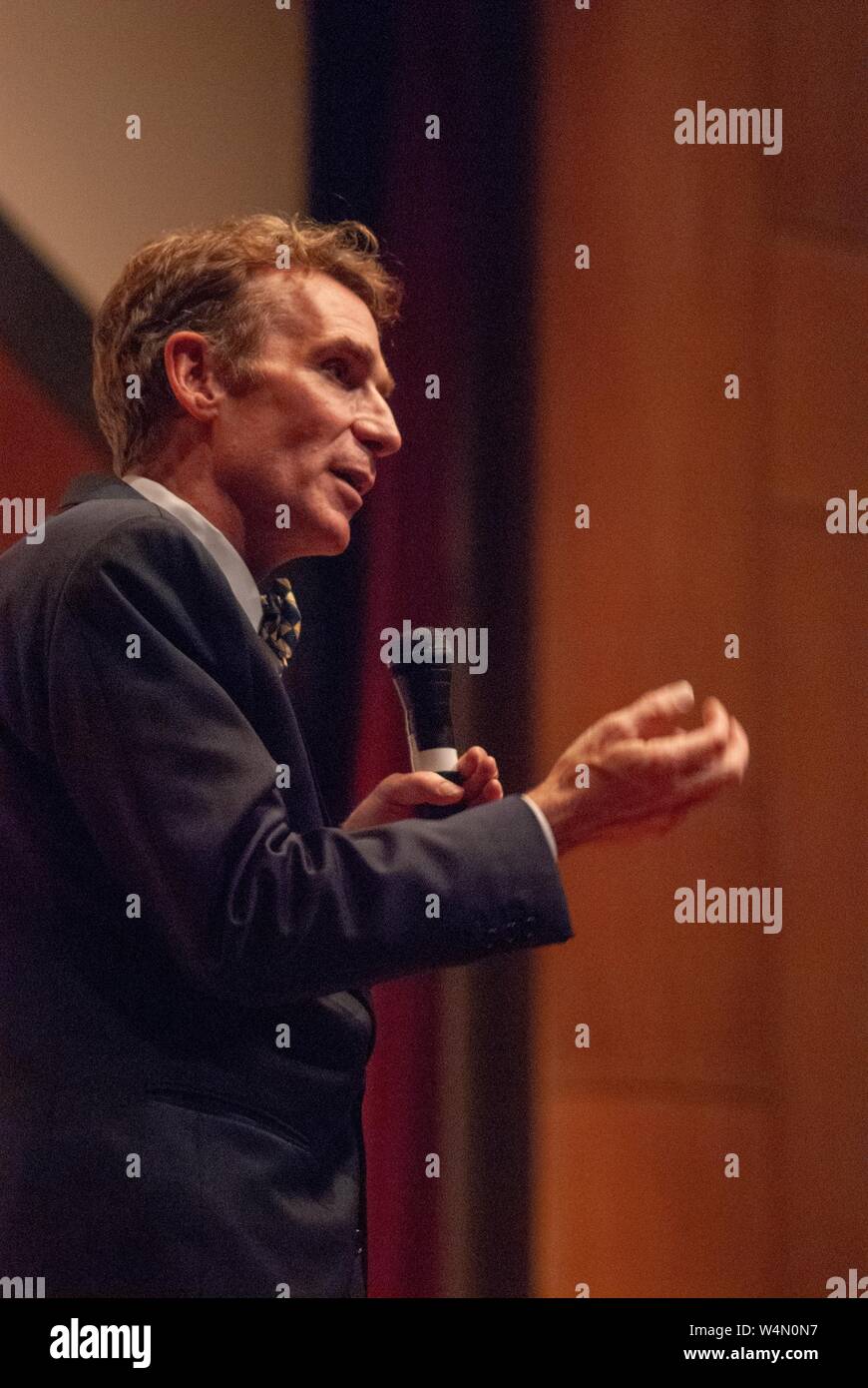 Low-angle profile shot of science communicator Bill Nye, speaking during a Milton S Eisenhower Symposium at the Johns Hopkins University, Baltimore, Maryland, October 23, 2007. From the Homewood Photography Collection. () Stock Photo