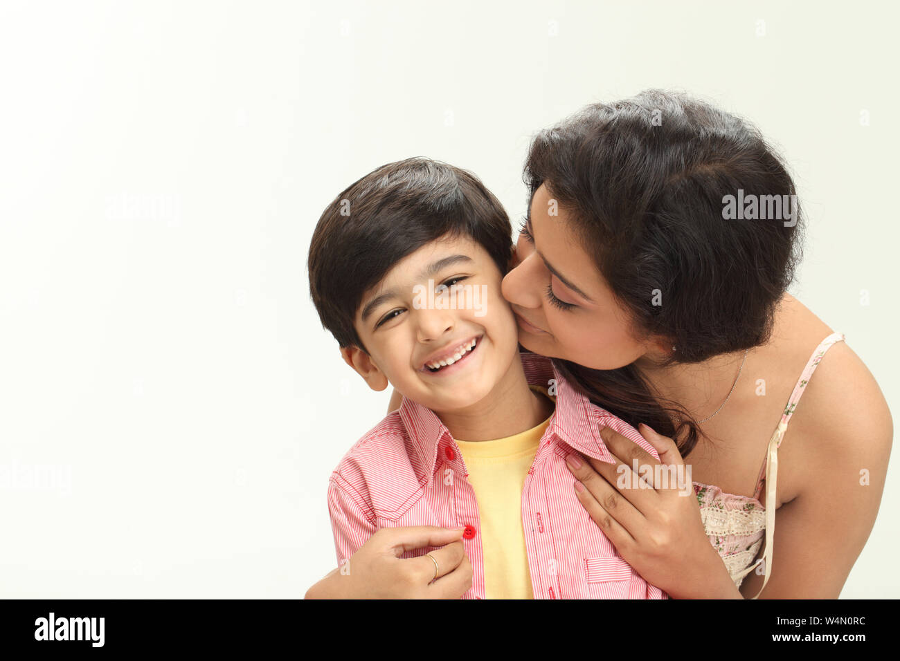 Boy kissing on cheek woman hi-res stock photography and images - Alamy