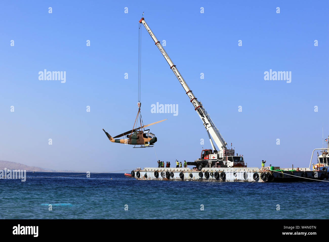 (190724) -- AMMAN, July 24, 2019 (Xinhua) -- A body of a military helicopter, donated by the Jordanian Royal Air Force, is submerged in the Red Sea off Aqaba, as part of a new underwater military museum, in south Jordan, July 24, 2019. The museum is built by Aqaba Special Economic Zone to attract more tourists in summer, (Photo by Mohammad Abu Ghosh/Xinhua) Stock Photo