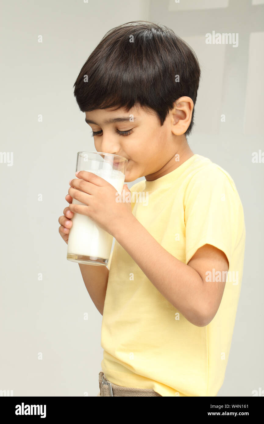 Boy drinking milk from a glass Stock Photo Alamy