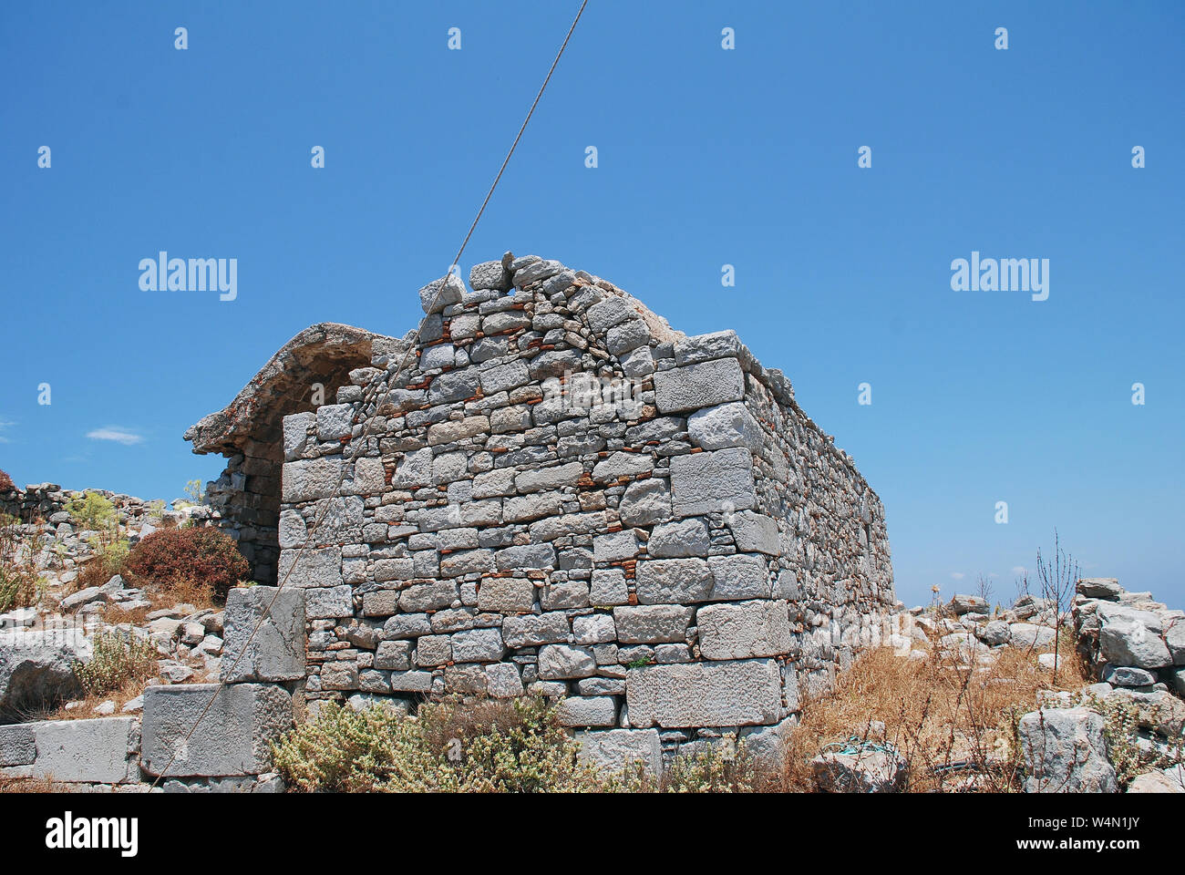 The ruins of the medieval Crusader Knights castle above Megalo Chorio on the Greek island of Tilos. Stock Photo