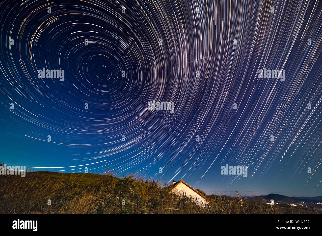 Star trails in the Dark Sky Reserve, over Valentia Island, County Kerry, Ireland Stock Photo