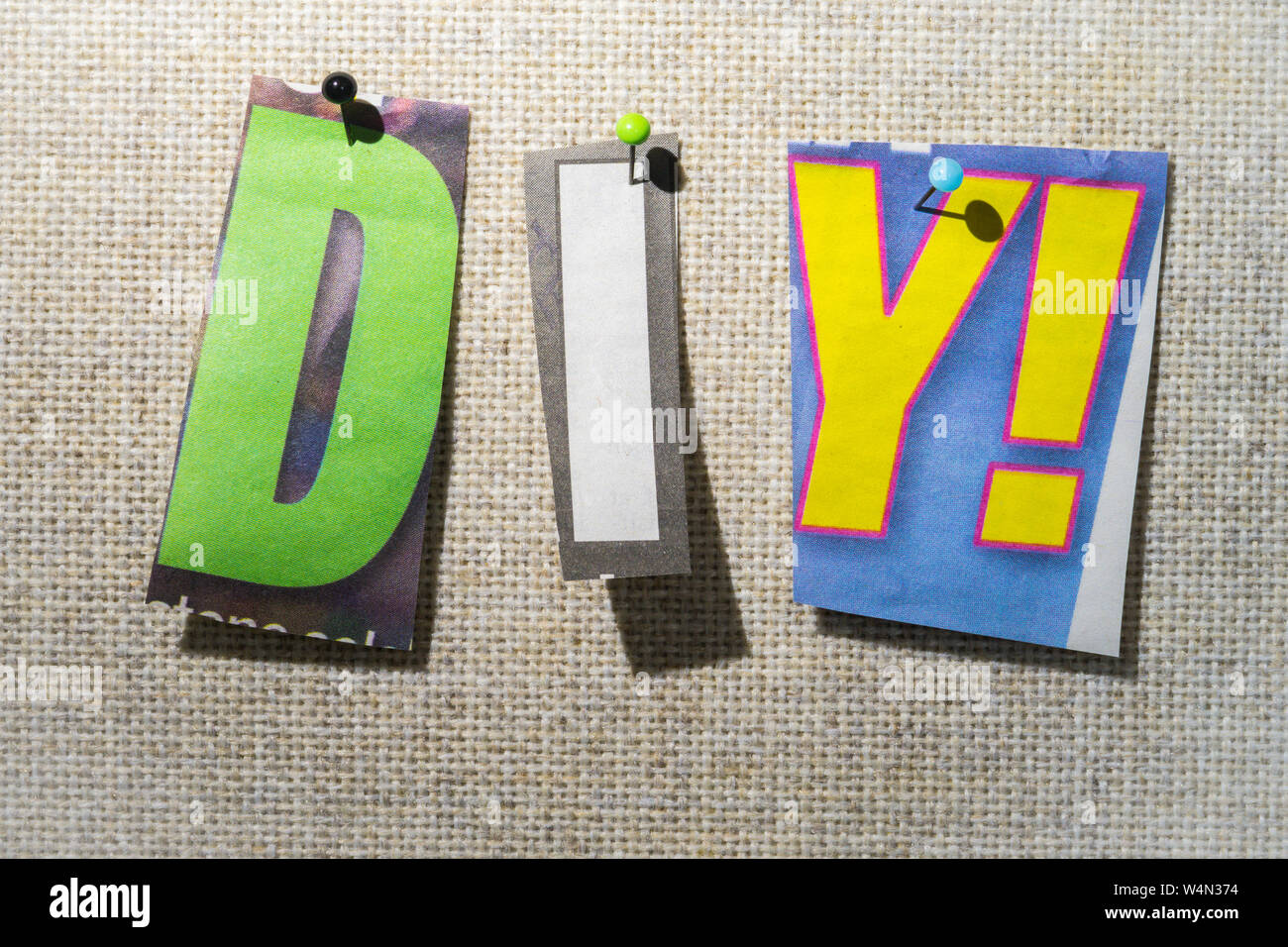 The DIY! Do it Yourself on a bulletin board using cut-out paper letters in  the ransom note effect typography Stock Photo - Alamy