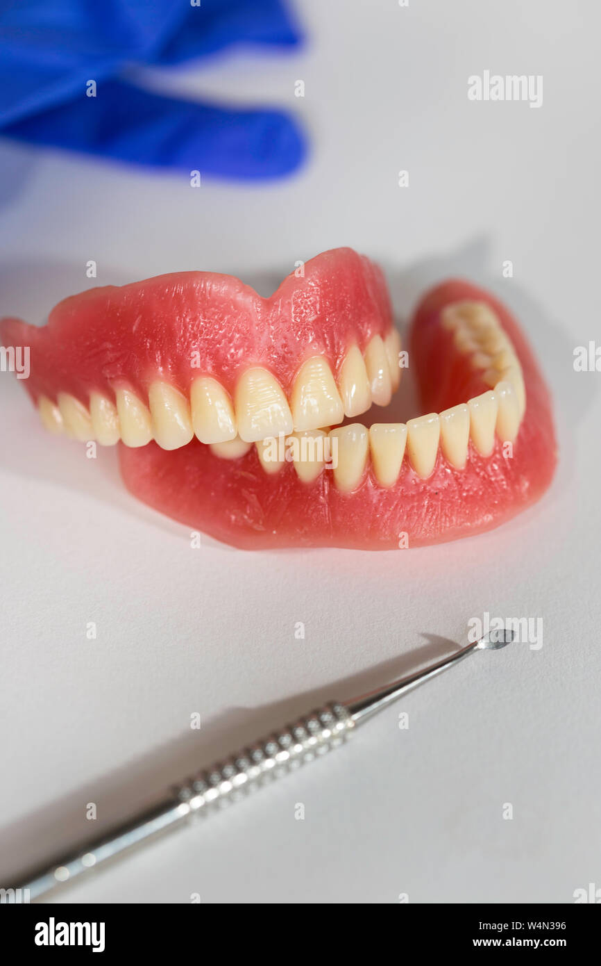 Complete Set of Dentures, USA with  dental tool, USA Stock Photo