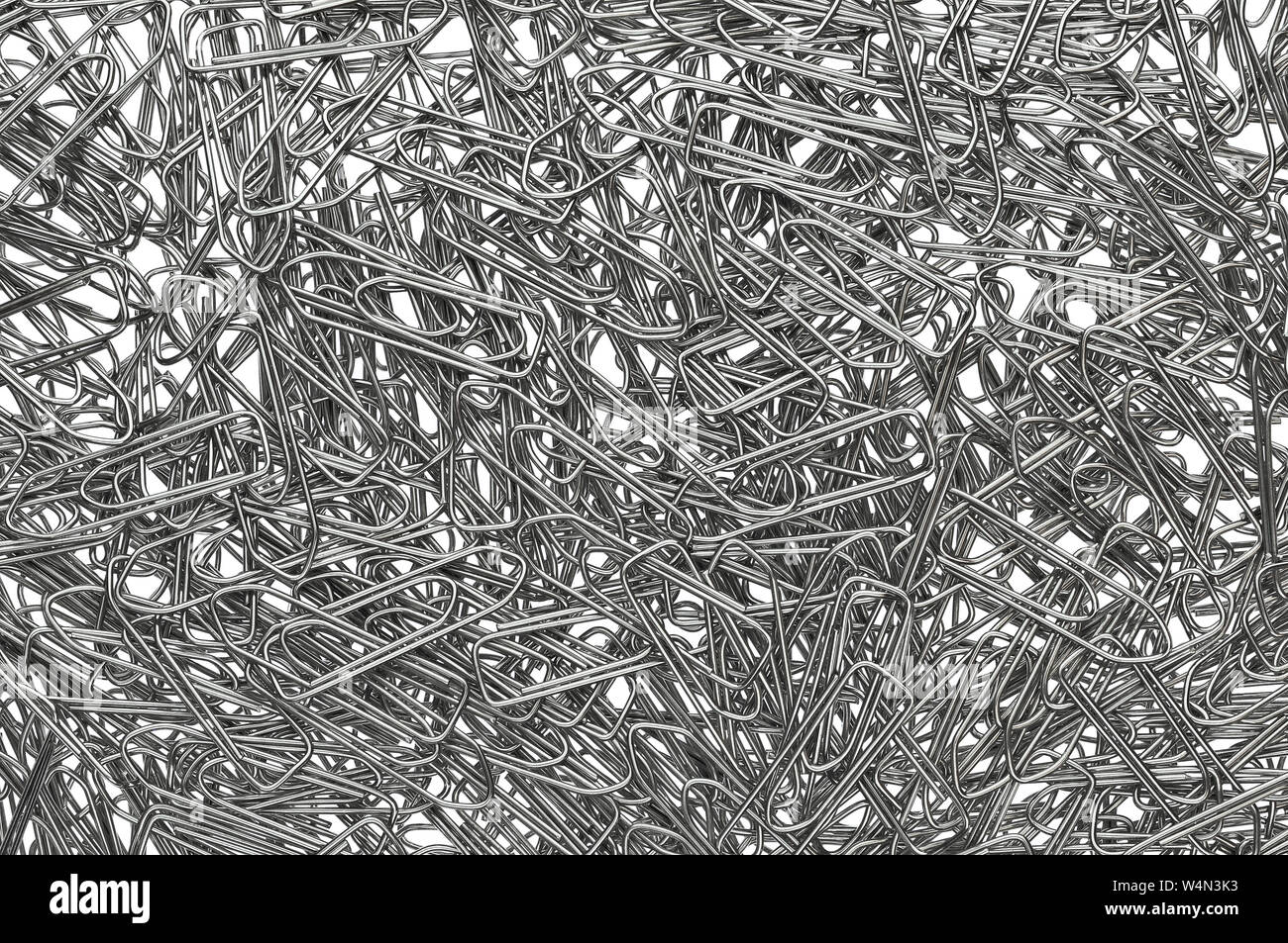 random pile of metal paper clips to use as a stationery background Stock Photo