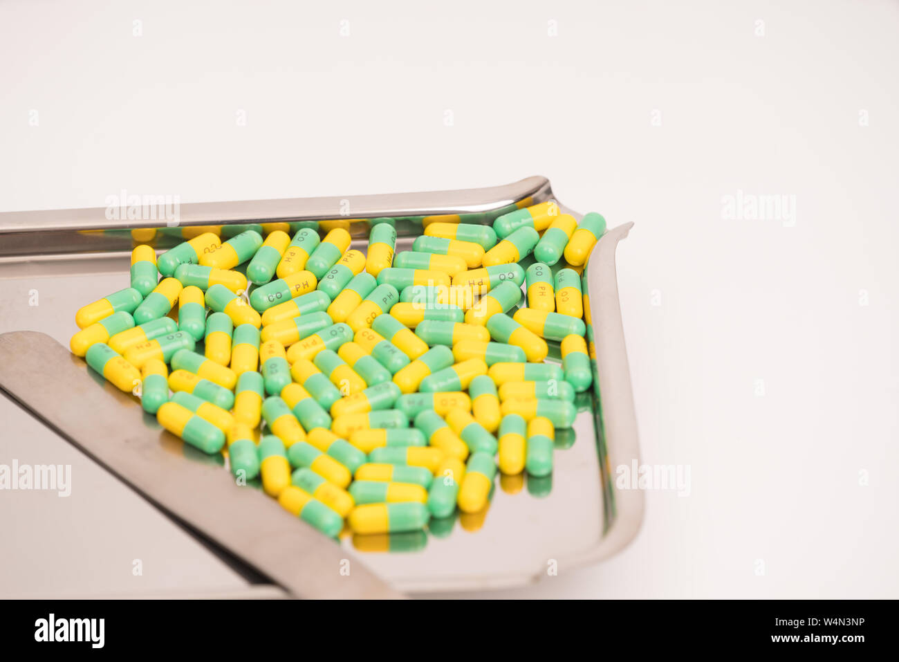 medical drug capsule on medical tray on white background Stock Photo
