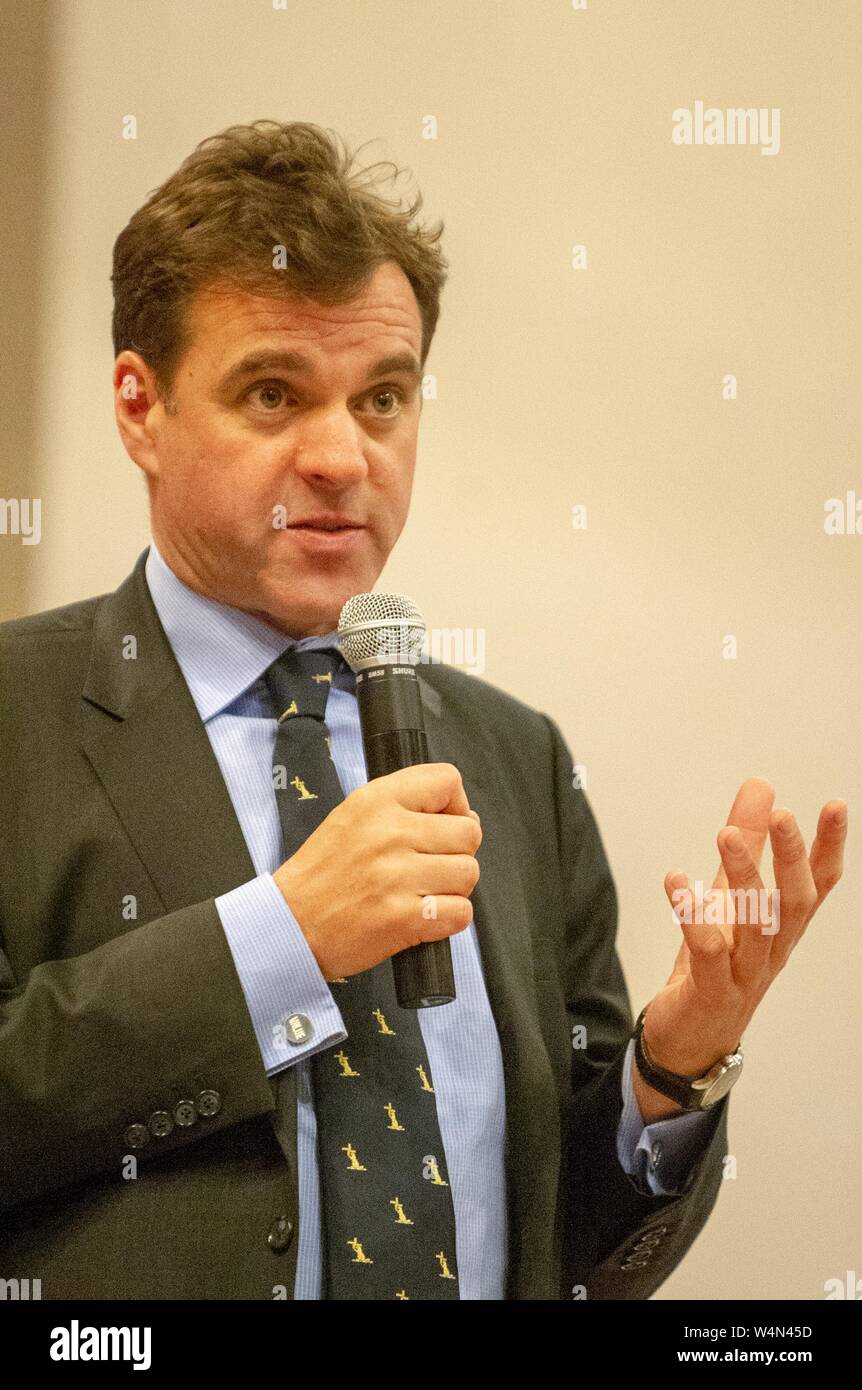 Close-up of Niall Ferguson, a Scottish economic historian, speaking into a microphone during a Foreign Affairs Symposium at the Johns Hopkins University, Baltimore, Maryland, March 24, 2010. From the Homewood Photography Collection. () Stock Photo