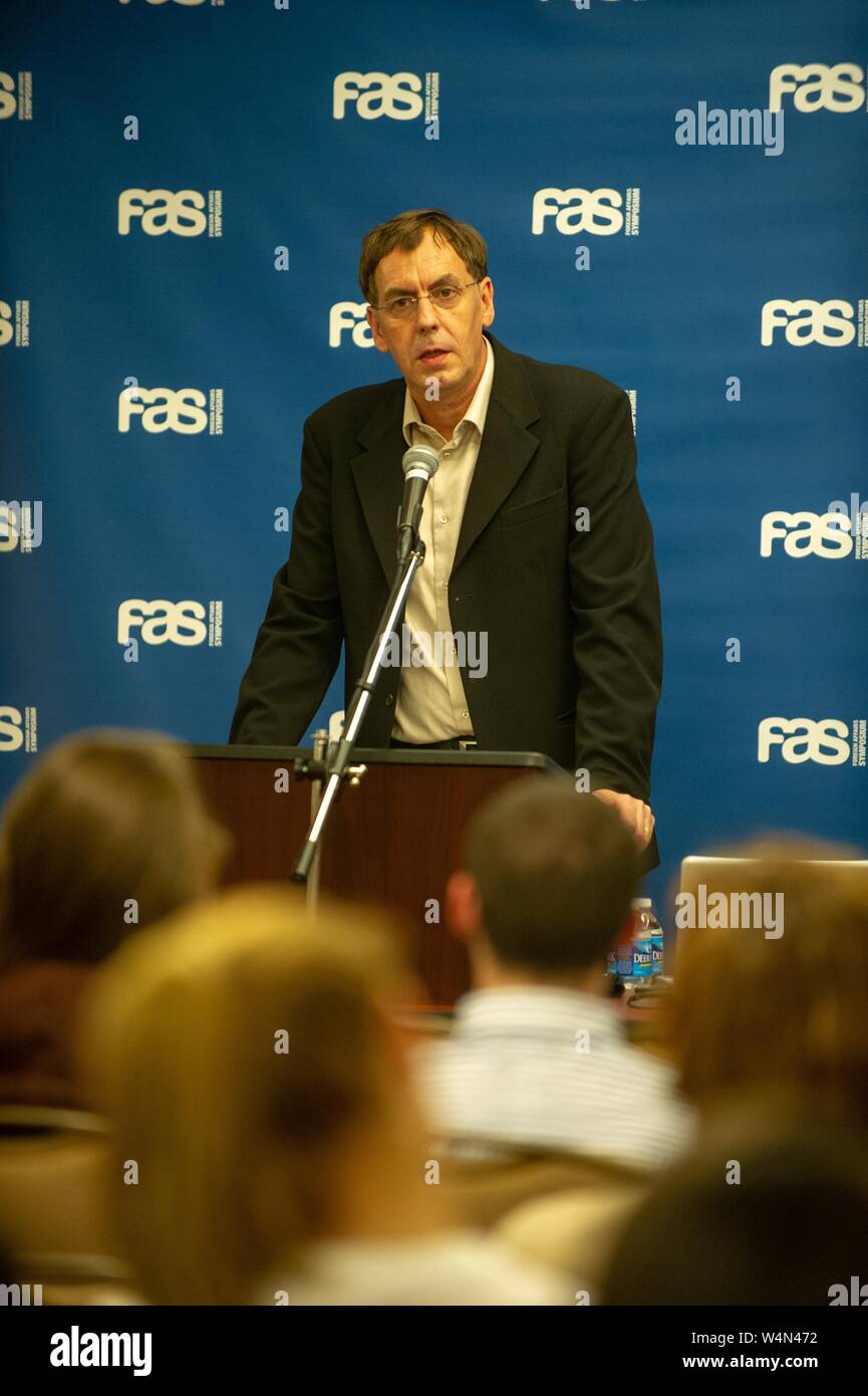 Jean-Herve Bradol, former president of Doctors Without Borders, speaking from a podium during a Foreign Affairs Symposium at the Johns Hopkins University, Baltimore, Maryland, April 15, 2010. From the Homewood Photography Collection. () Stock Photo