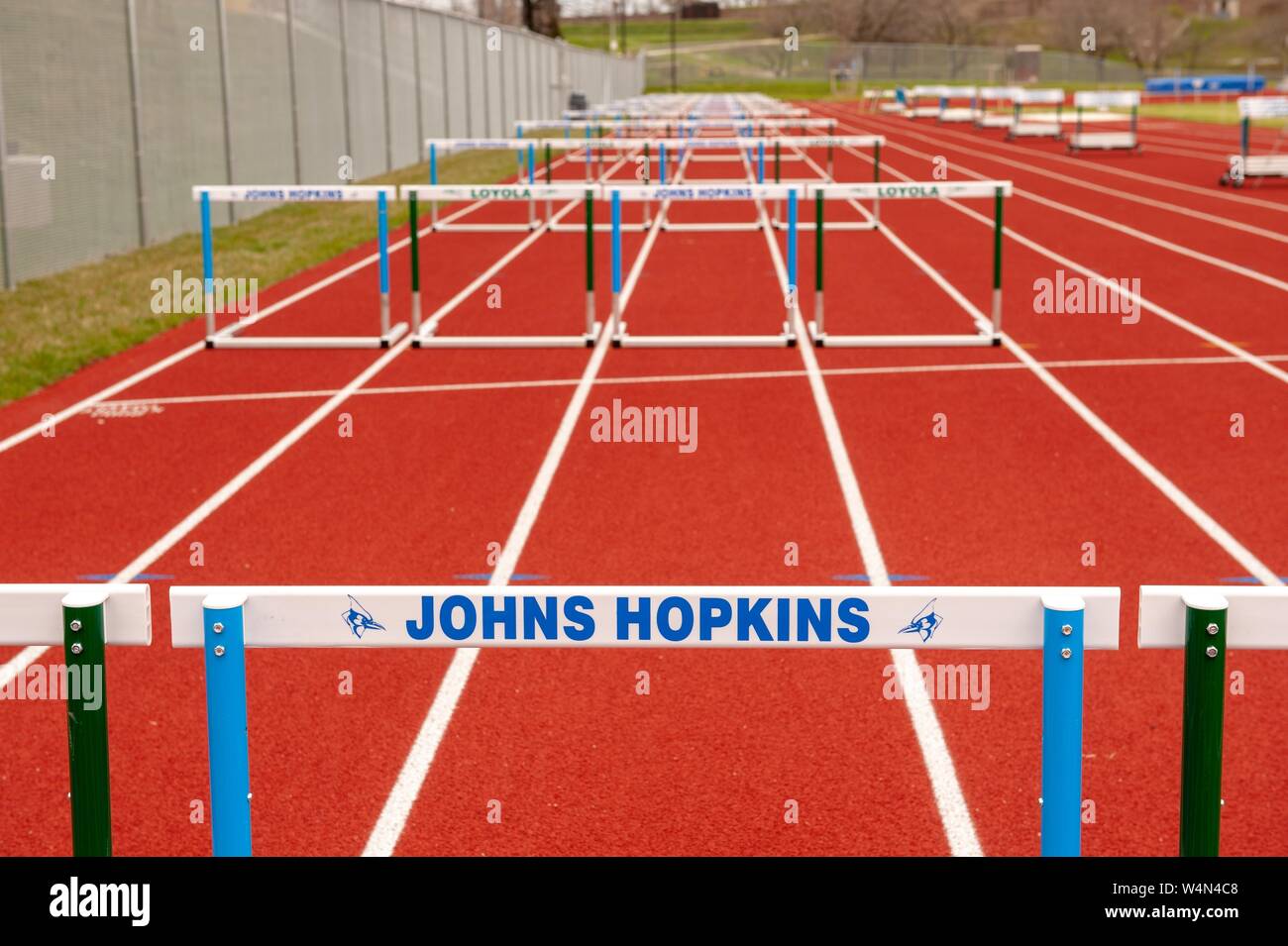 Close-up of a hurdle labeled 'Johns Hopkins, ' on a track with rows of hurdles, some labeled 'Loyola, ' at the Johns Hopkins University, Baltimore, Maryland, April 8, 2009. From the Homewood Photography Collection. () Stock Photo