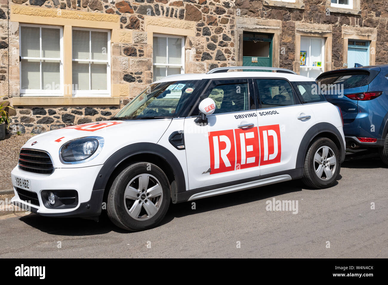 RED driving school car, Scotland, UK Stock Photo