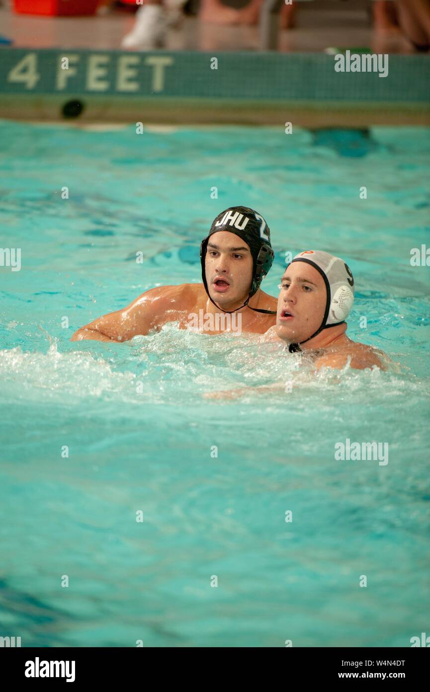 A Johns Hopkins Blue Jays Men's Water Polo team member covers an opposing player while participating in a game with Princeton University, October 17, 2009. From the Homewood Photography Collection. () Stock Photo