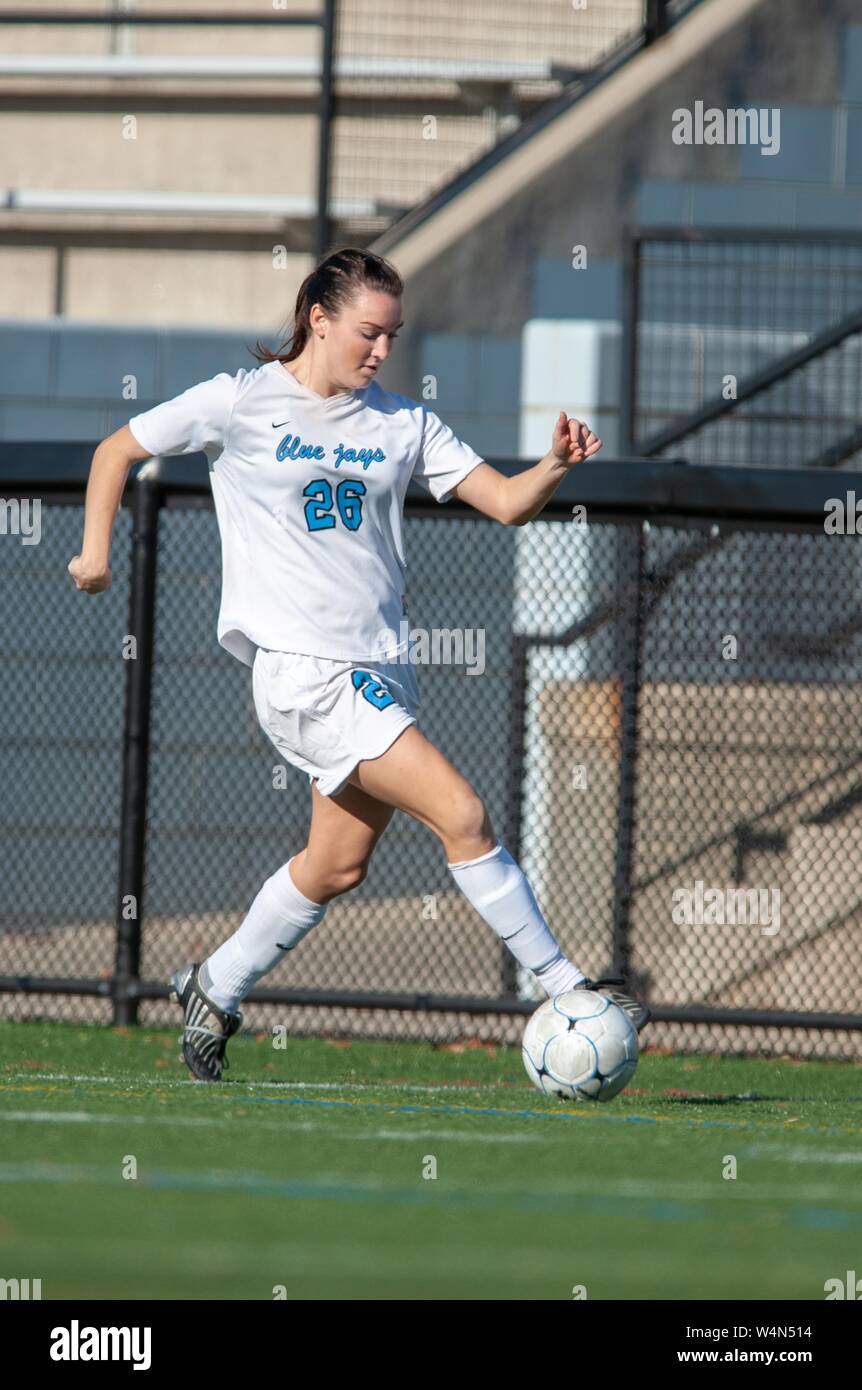 Johns Hopkins Blue Jays Women's Soccer player Erica Suter, in full-length profile, kicking a ball while participating in the NCAA Tournament at the Johns Hopkins University, Baltimore, Maryland, November 15, 2009. From the Homewood Photography Collection. () Stock Photo
