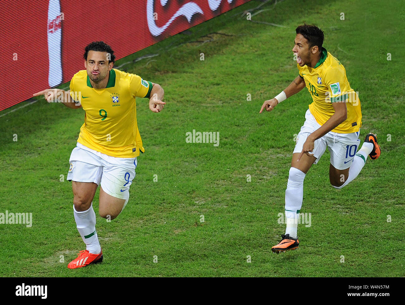 The soccer players of the Brazilian team, Fred and Neymar, celebrating the goal during the game Brazil vs. Spain in the final of the Confederations Cu Stock Photo