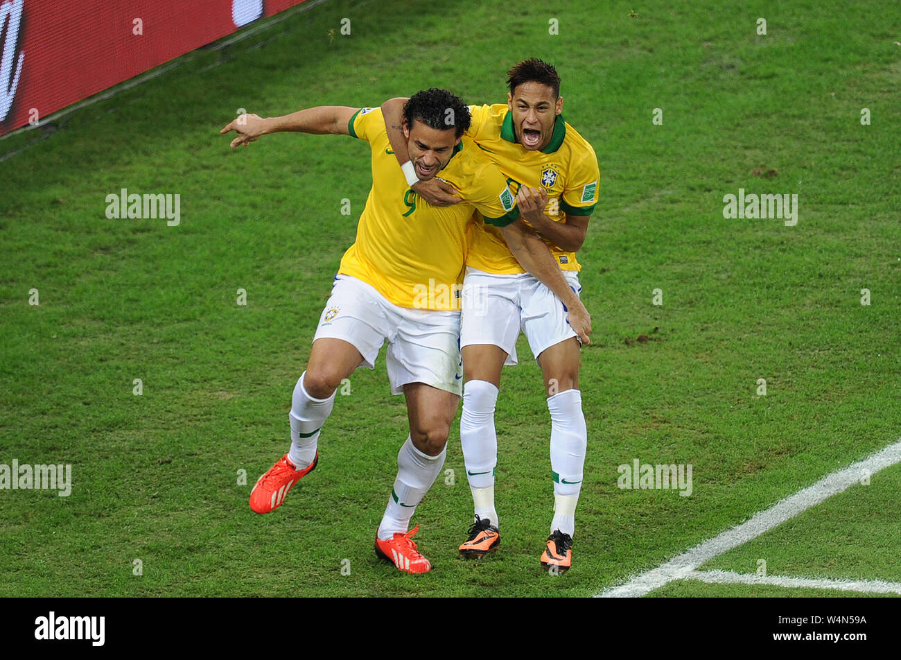 The soccer players of the Brazilian team, Fred and Neymar, celebrating the goal during the game Brazil vs. Spain in the final of the Confederations Cu Stock Photo