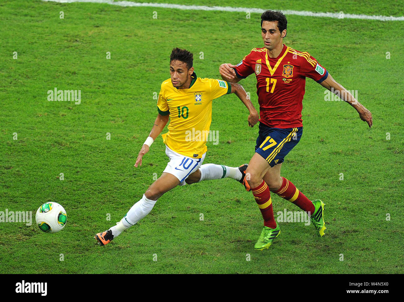 Brazilian soccer player Neymar, kicks to score his goal in the game Brasil x Espanhã in the final of the Confederations Cup 2013, in Etadio do Maracan Stock Photo