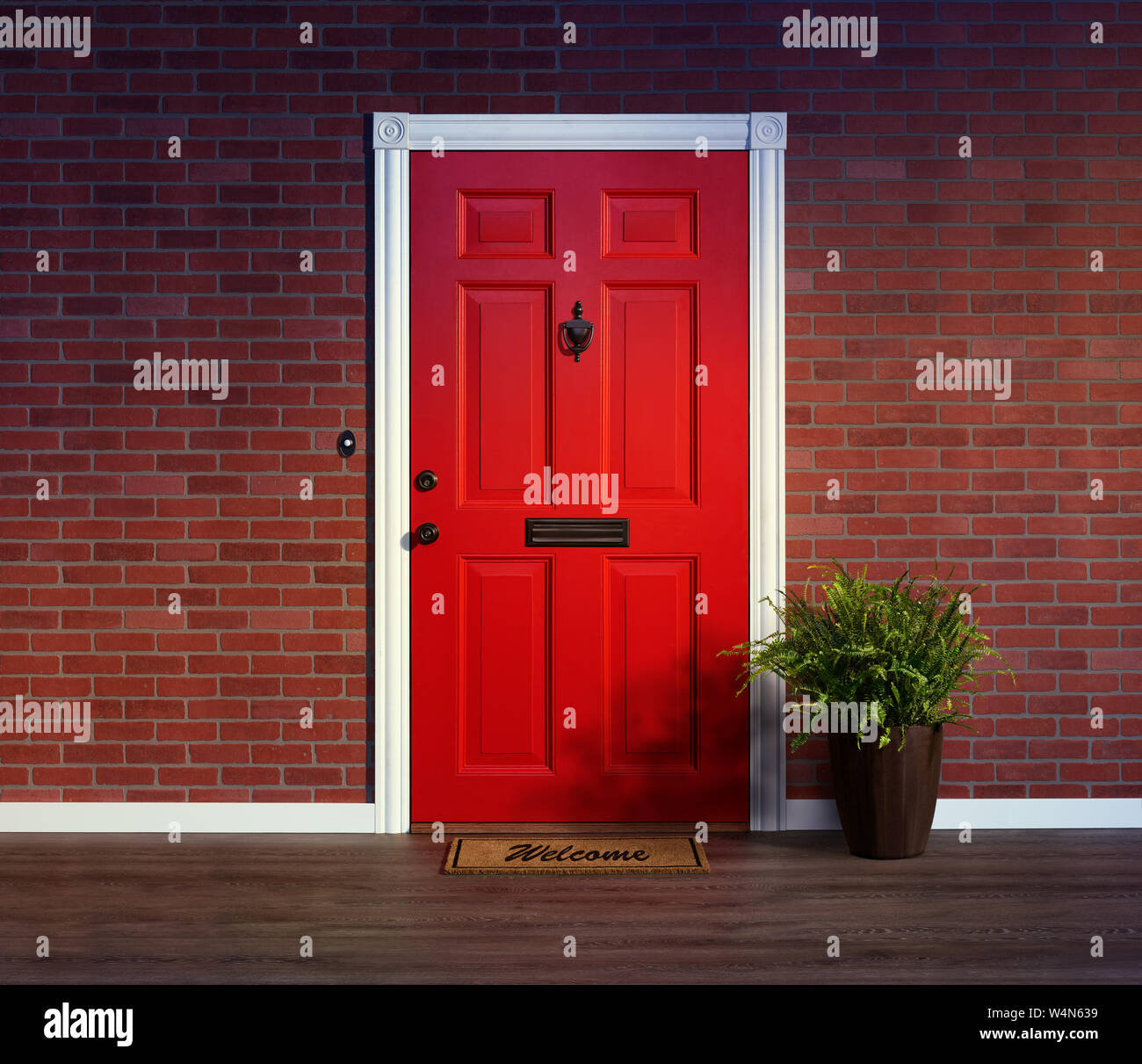 Inviting red front door with welcome mat and potted fern plant Stock Photo