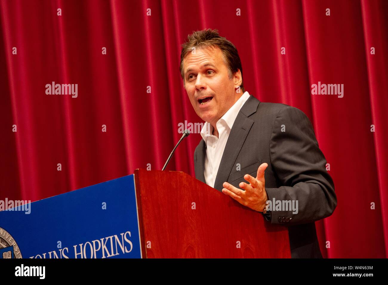 Angled shot of Richard Roeper, columnist and film critic, speaking from a podium during a Milton S Eisenhower Symposium at the Johns Hopkins University, Baltimore, Maryland, October 5, 2010. From the Homewood Photography Collection. () Stock Photo