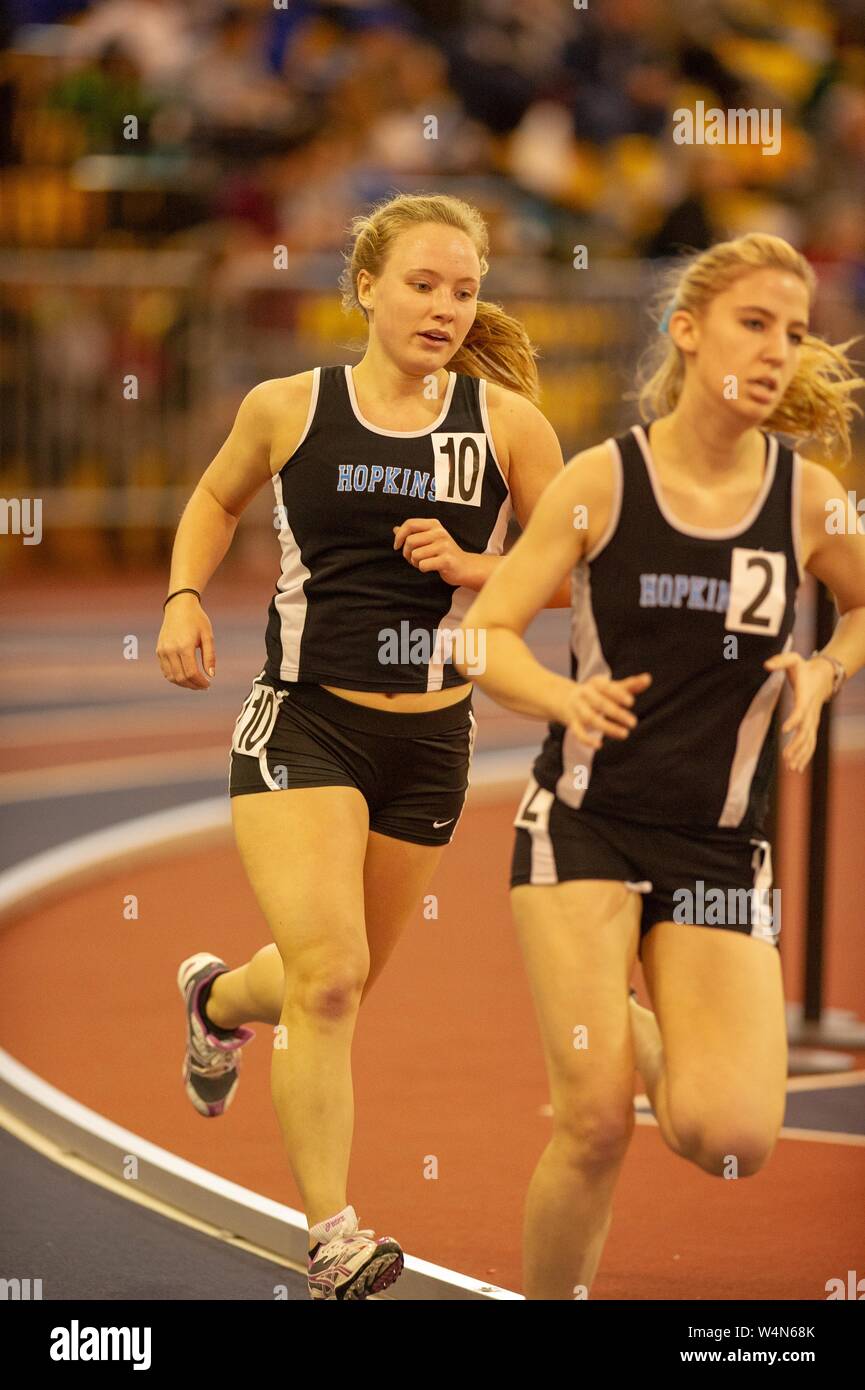 Members of the Johns Hopkins Blue Jays Women's Track and Field team participate in a race on an indoor track, at the Johns Hopkins University, Baltimore, Maryland, January 16, 2010. From the Homewood Photography Collection. () Stock Photo