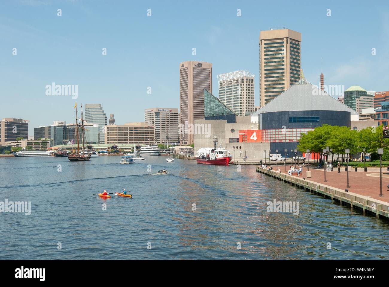 Inner Harbor and urban skyline of Baltimore, Maryland, with aquarium visible, on a sunny day, May 4, 2006. () Stock Photo